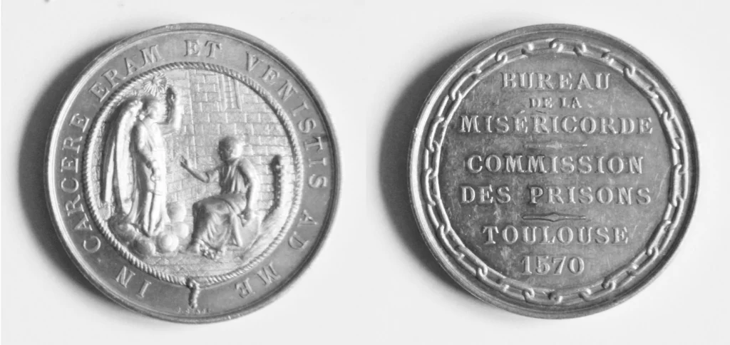 Photo noir et blanc de la médaille signée J. Canot, à l'effigie de la Miséricorde, 1878.